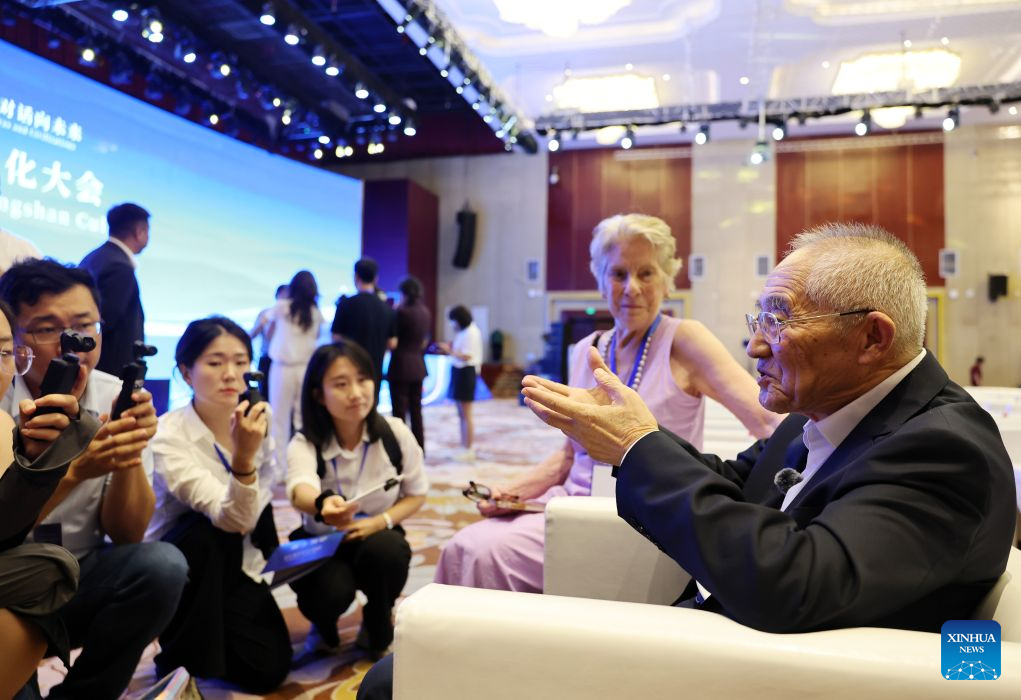 Archaeologist Guo Dashun (1st R) talks to the media after the 2026 Conference on Hongshan Culture in Chaoyang City, northeast China's Liaoning Province, Aug. 5, 2026. Themed on Hongshan Culture: A Dialogue Between Eras and Civilizations, the 2026 Conference on Hongshan Culture kicked off here on Wednesday. (Xinhua/Li Gang)