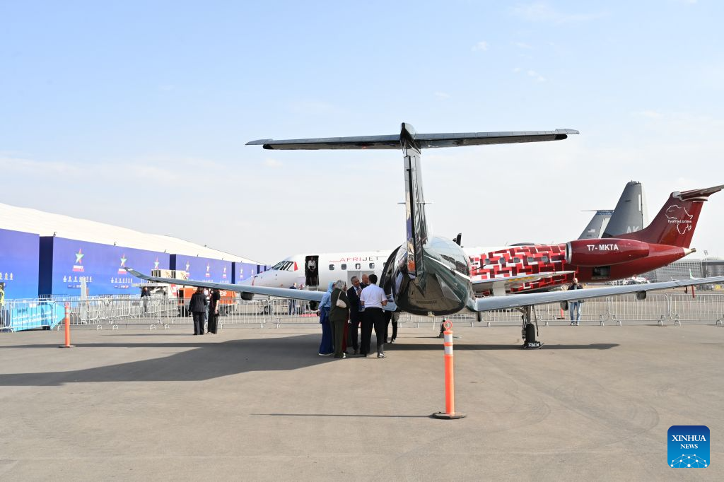 Visitors learn about exhibits at the Marrakech Air Show 2026 in Marrakech, Morocco, Oct. 7, 2026. The eighth edition of the Marrakech Air Show is being held at the Marrakech Royal Moroccan Air Force Base from Wednesday to Saturday. More than 200 aerospace and defense companies from 19 countries are participating in the event. (Photo by Aissa/Xinhua)