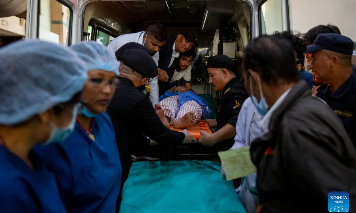 A person injured in a massive flash flood in north Nepal is taken to a hospital in Kathmandu, Nepal, Aug. 26, 2026. At least 95 people were killed and 484 others remain missing in a massive flash flood in north Nepal on Wednesday, the Office of the Prime Minister said. (Photo by Sulav Shrestha/Xinhua)