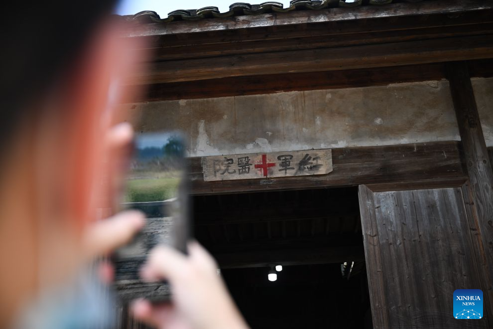 A visitor takes photos at a former Red Army hospital site in Chentang Village of Shibi Town in Ninghua County, southeast China's Fujian Province, Sept. 9, 2026. This year marks the 90th anniversary of the victory of the Long March by the Red Army under the leadership of the Communist Party of China (CPC). The former Red Army hospital site is located in Chentang Village, Ninghua County, one of the starting points of the Long March by the Central Red Army. (Xinhua/Zheng Huansong)