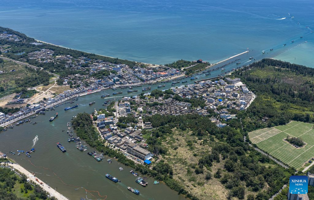 An aerial drone photo taken on Aug. 16, 2026 shows fishing boats departing for fishing from Tanmen port in Qionghai, south China's Hainan Province. The fishing season of the South China Sea kicked off at noon on Sunday after this summer's three-and-a-half-month fishing ban. (Xinhua/Pu Xiaoxu)