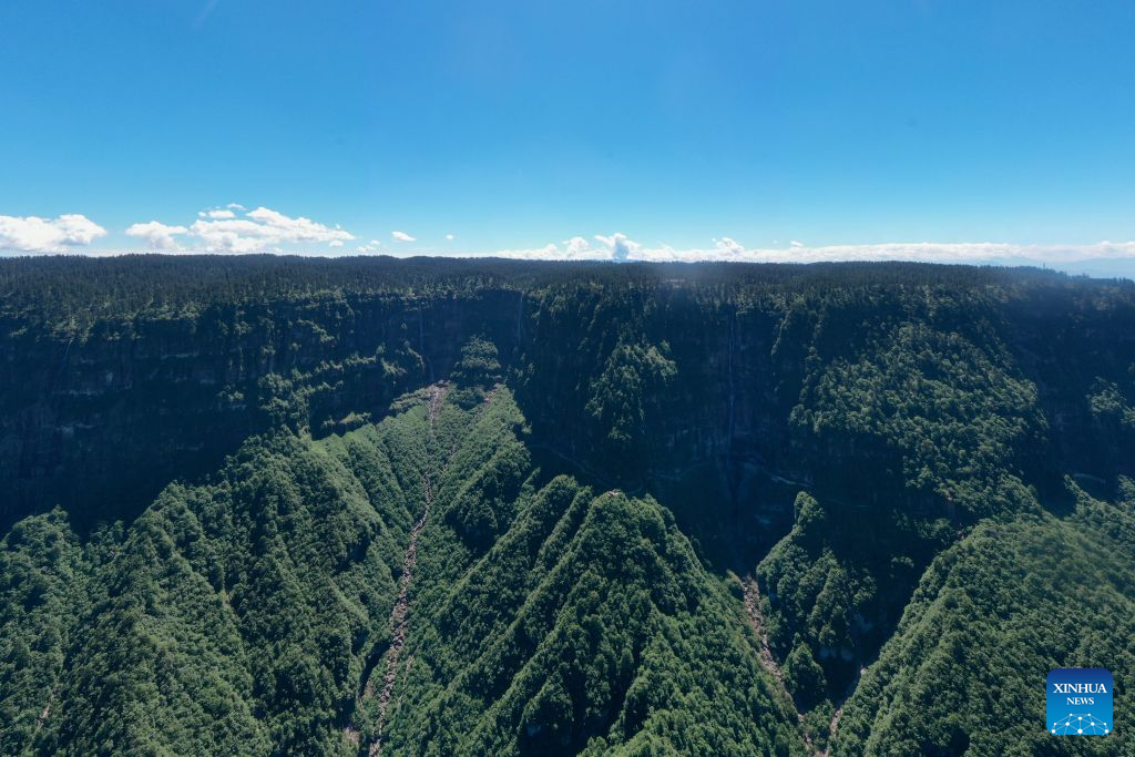 An aerial drone photo taken on July 19, 2026 shows a panorama view of the Wawu Mountain in Hongya County, southwest China's Sichuan Province. Known for its distinctive table-mountain landform, Wawu Mountain features a summit plateau covering about 11 square kilometers, making it a popular tourist destination. (Xinhua/Xu Bingjie)
