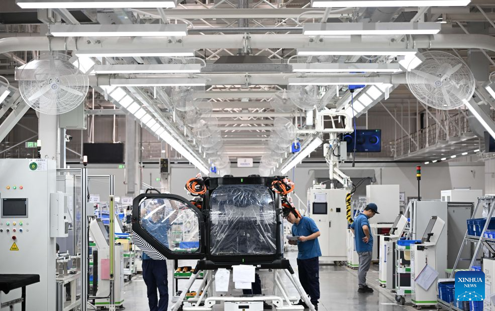 Staff members are seen busy at the general assembly workshop of ARIDGE's plant for mass production of flying cars in Guangzhou, south China's Guangdong Province, Aug. 10, 2026.

A roll-off ceremony for the 1,000th set of electric propulsion system for ARIDGE's flying car, dubbed the Land Aircraft Carrier, was held at the company's plant for mass production of flying cars in Guangzhou on Monday.

ARIDGE is a pioneering developer of low-altitude mobility solutions based in Guangdong. Its plant for mass production of flying cars here, covering an area of approximately 120,000 square meters, mainly manufactures the airborne component of the Land Aircraft Carrier. (Xinhua/Deng Hua)