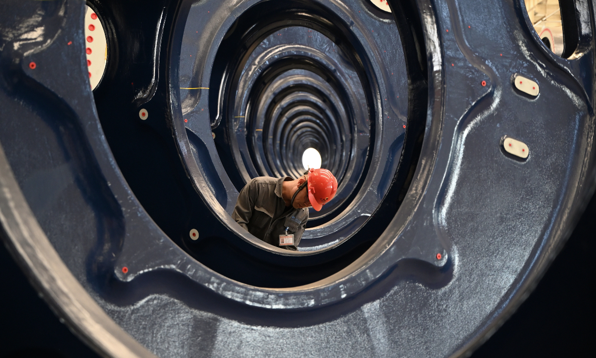 Workers carry out regular maintenance on wind turbine hubs inside the work shop of Eastern Inner Mongolia (Tongliao) Wind Power Equipment Manufacturing Industrial Base in Tongliao, North China's Inner Mongolia Autonomous Region, on August 9, 2026. Photo: VCG