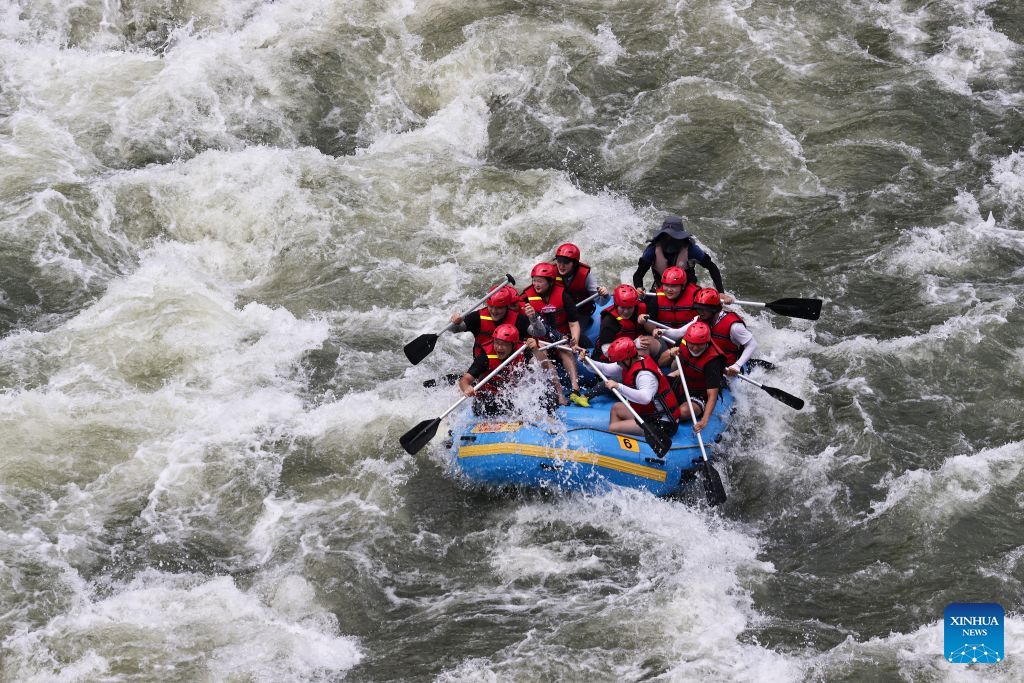 People enjoy rafting at Hantan river valley in Cheorwon, Gangwon province, South Korea, Aug. 2, 2026. (Photo by Jun Hyosang/Xinhua)