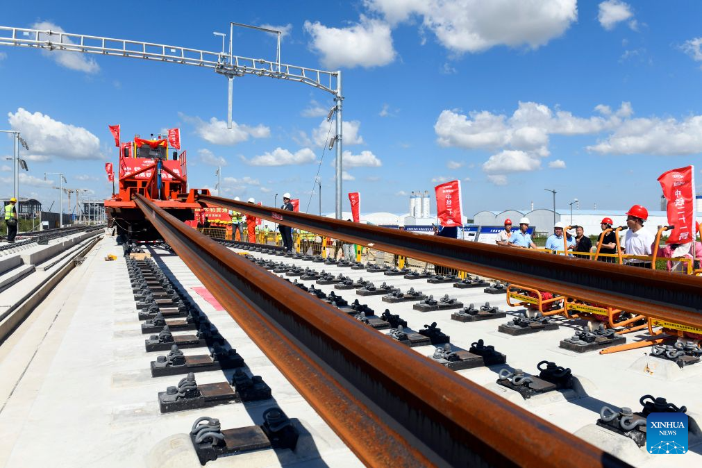 Staff members from China Railway 21st Bureau Group Corporation Limited carry out a continuous welded rail installation task for the Tianjin-Weifang High-Speed Railway at the Dongying South Railway Station in Dongying City, east China's Shandong Province, Sept. 1, 2026. The construction of the Tianjin-Weifang High-Speed Railway entered the track-laying phase on Tuesday, with continuous welded rail installation tasks starting respectively from Dongying South Railway Station and Binzhou Railway Station on the day.

Connecting Binhai Station in north China's Tianjin Municipality and Weifang North Station in east China's Shandong Province with a total length of approximately 349 kilometers and a designed speed of 350 kilometers per hour, the Tianjin-Weifang High-Speed Railway belongs to a greater high-speed rail artery network consisting eight vertical lines and eight horizontal lines in the country. (Xinhua/Guo Xulei)