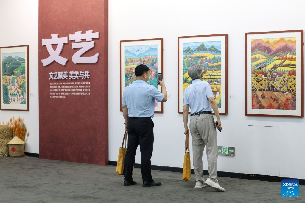 Visitors view artworks during a farmer painting exhibition at the Xinhua News Agency Art Museum in Beijing, capital of China, Aug. 25, 2026. (Xinhua/Wang Jingqiang)
