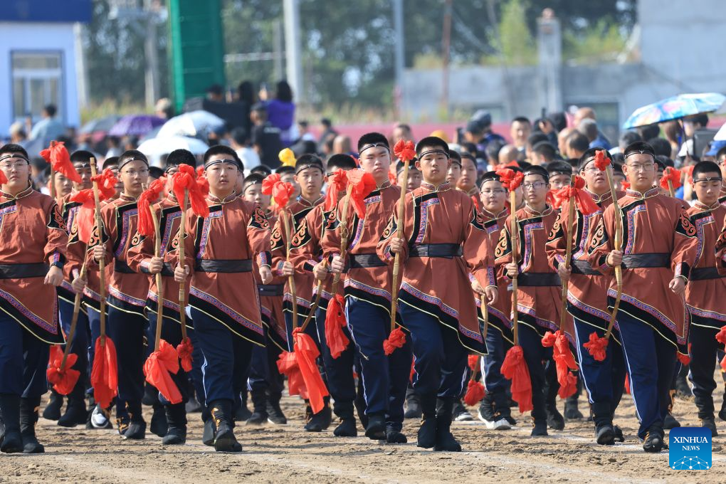 Young archers march during the opening ceremony of a Nadam fair in the Mongolian Autonomous County of Dorbod, Daqing City, northeast China's Heilongjiang Province, Sept. 6, 2026. The event was held here on Sunday. It featured cultural performances and folk activities, offering tourists and local residents a celebration of grassland culture. (Photo by Xu Shuai/Xinhua)