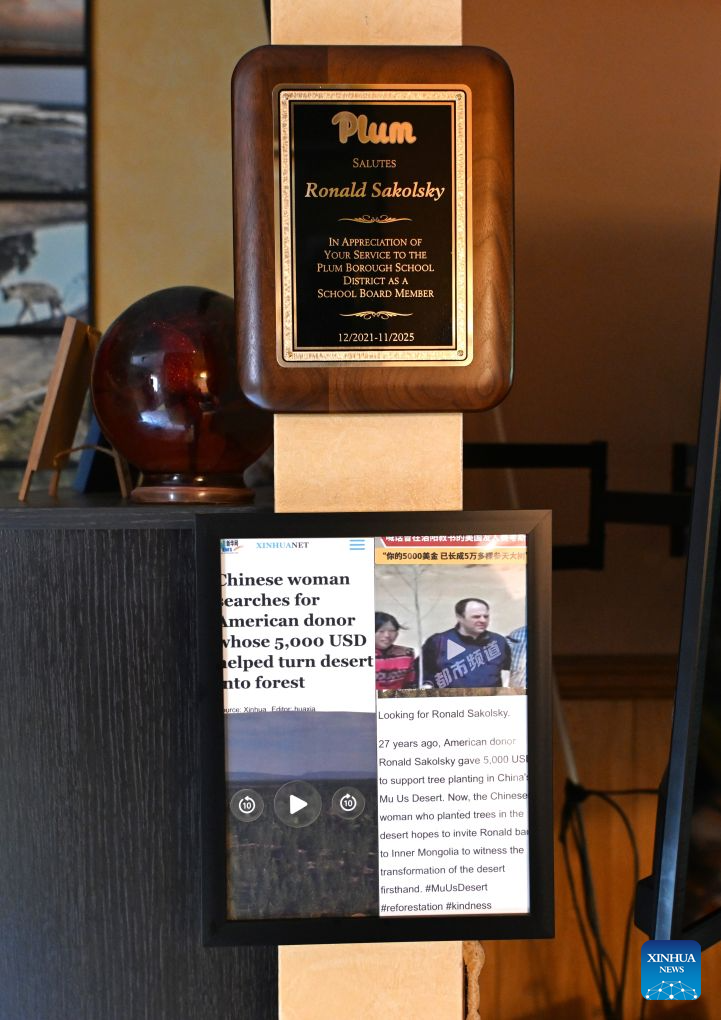 A printout of a Xinhua report about Yin Yuzhen's online search for Sakolsky is pictured at Ronald Sakolsky's home in Plum, a suburb east of Pittsburgh, Pennsylvania, the United States, on June 16, 2026. TO GO WITH Feature: From 5,000 USD to 50,000 trees: an American teacher and a Chinese woman's efforts to green a desert (Xinhua/Li Rui)