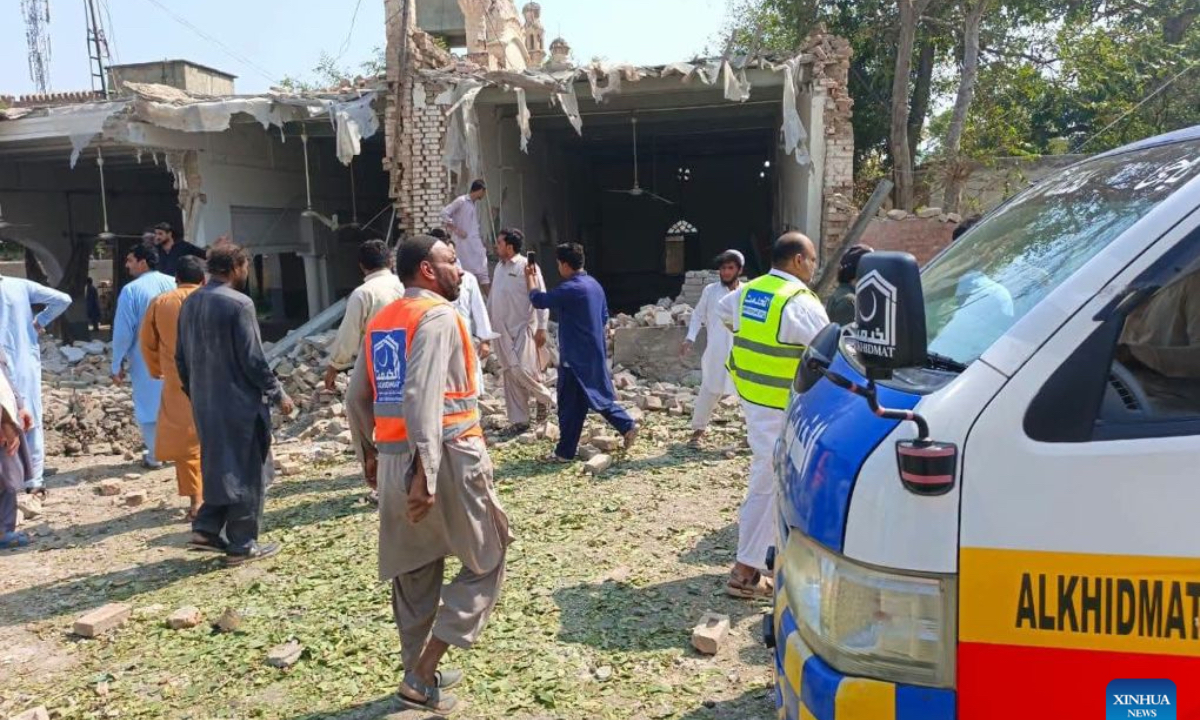 This photo taken with mobile phone shows a blast site at Kohat in Pakistan's Khyber Pakhtunkhwa province on Sept. 18, 2026. At least 16 people were killed and over 50 others injured in a twin suicide attack inside a residential compound of police in Pakistan's Khyber Pakhtunkhwa province on Friday, police and rescue officials said. (Str/Xinhua)