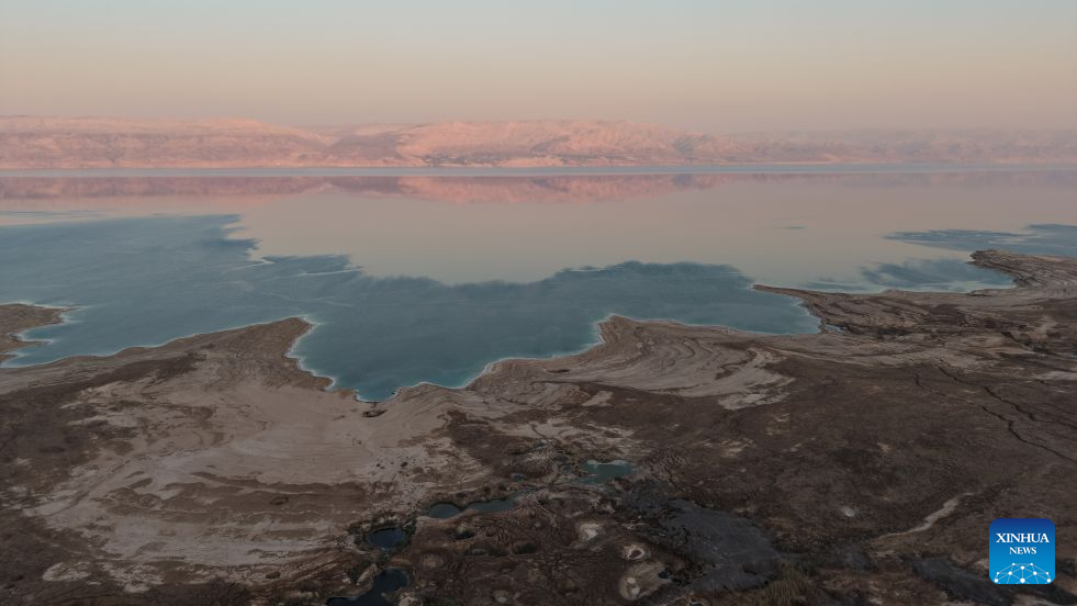 An aerial drone photo taken on Aug. 24, 2026 shows a view of the Dead Sea and sinkholes near Ein Gedi beach of Israel. (Photo by Gil Cohen Magen/Xinhua)