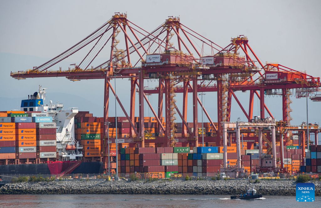 Cargo containers are stacked at a container terminal at the Port of Vancouver in Vancouver, British Columbia, Canada, Aug. 25, 2026. The Canadian federal government on Tuesday announced retaliatory tariffs on over 700 U.S. goods valued at 27.6 billion Canadian dollars (about 20 billion U.S. dollars), alongside a 7.5-billion-Canadian-dollar assistance package for domestic businesses and workers. (Photo by Liang Sen/Xinhua)