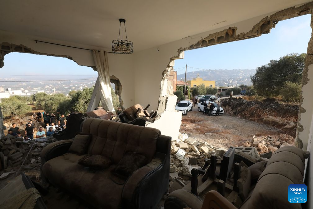 Palestinians inspect a building after the Israeli forces destroyed it, in the town of Aqraba, south of Nablus in the West Bank, on Sept. 8, 2026. A Palestinian man was killed by Israeli army fire on Tuesday in the town of Aqraba, south of Nablus in the northern West Bank. (Photo by Nidal Eshtayeh/Xinhua)