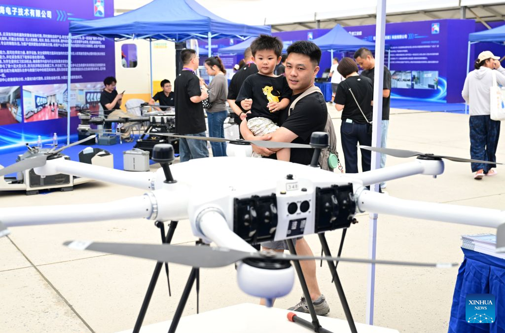 This photo taken on Sept. 20, 2026 shows people watching a drone during the All-Space Unmanned Ecosystem Conference & Equipment Achievement Exhibition at Luogang Park in Hefei, east China's Anhui Province. Various unmanned technologies are displayed during the World Manufacturing Conference. As part of the event, the All-Space Unmanned Ecosystem Conference & Equipment Achievement Exhibition is held in Luogang Park, displaying the latest technologies, products and scenarios solutions in the field of all-space unmanned system. (Xinhua/Zhou Mu)
