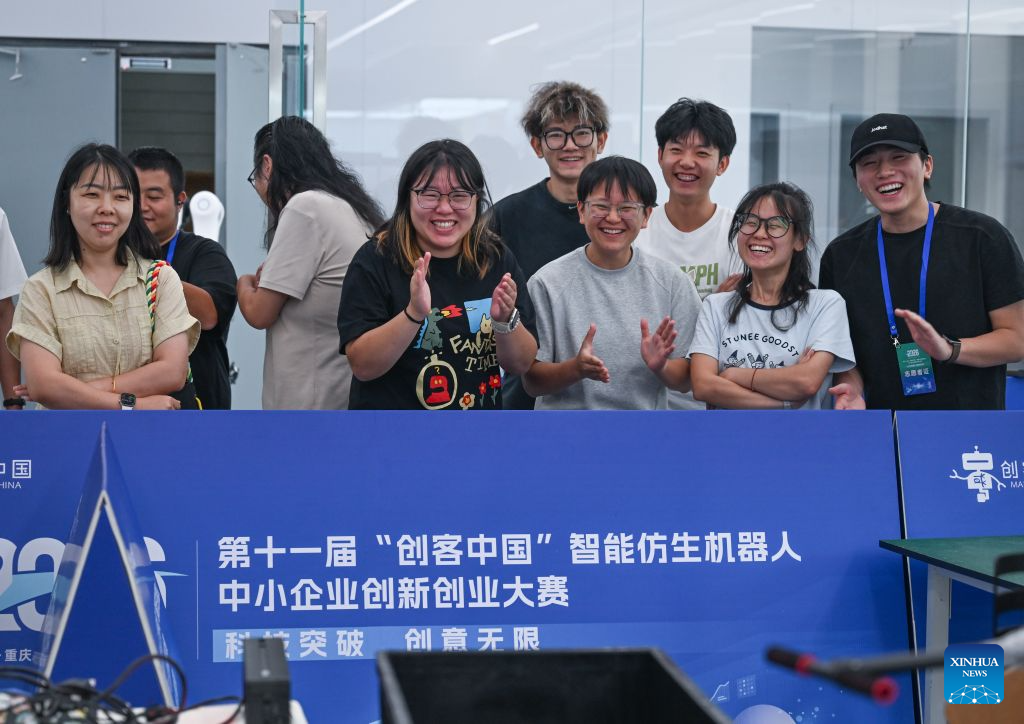 Spectators applaud during the final of the 11th Maker in China intelligent bionic robot innovation and entrepreneurship competition for small and medium-sized enterprises in Chongqing, southwest China, Sept. 9, 2026. The final of the event kicked off in Chongqing on Wednesday, with the participation of some 100 teams from all over the country. This competition will last until Sept. 11. (Xinhua/Chen Cheng)