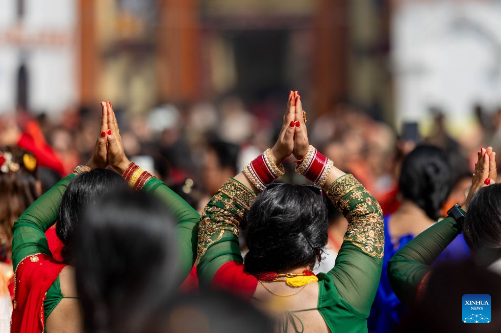 Women offer prayers at the Pashupatinath Temple during the Teej Festival in Kathmandu, Nepal, Sept. 14, 2026. Hindu women observe the festival by fasting, praying and celebrating, seeking marital well-being and ideal partners. (Photo by Sulav Shrestha/Xinhua)