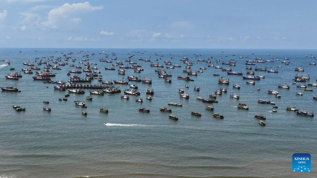 An aerial drone photo taken on Aug. 16, 2026 shows fishing boats departing for fishing in Beihai, south China's Guangxi Zhuang Autonomous Region. The fishing season of the South China Sea kicked off at noon on Sunday after this summer's three-and-a-half-month fishing ban. (Photo by He Jiahai/Xinhua)
