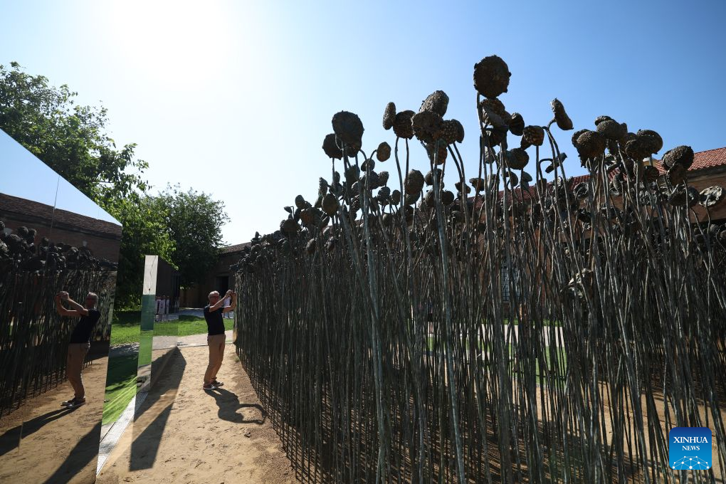 Visitors watch an exhibit themed Symbiosis at the China pavilion themed Dream Stream of the 61st International Art Exhibition of La Biennale di Venezia in Venice, Italy, Sept. 1, 2026. (Xinhua/Wang Kaiyan)