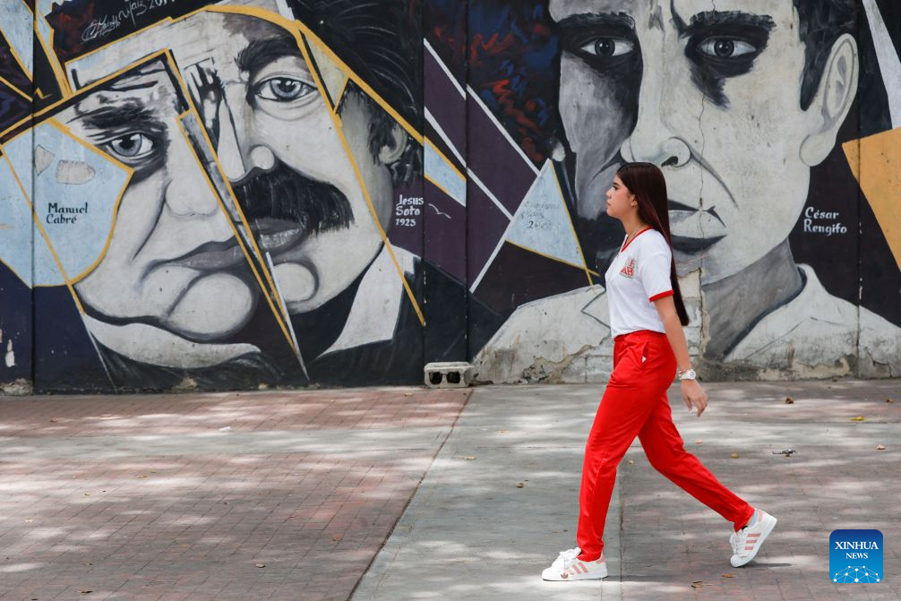 A student is pictured near a school, in Caracas, Venezuela, Sept. 14, 2026. More than 6 million Venezuelan students began the new school year on Monday, including those in La Guaira state in the country's north, which was hard hit by earthquake. (Photo by Marcos Salgado/Xinhua)
