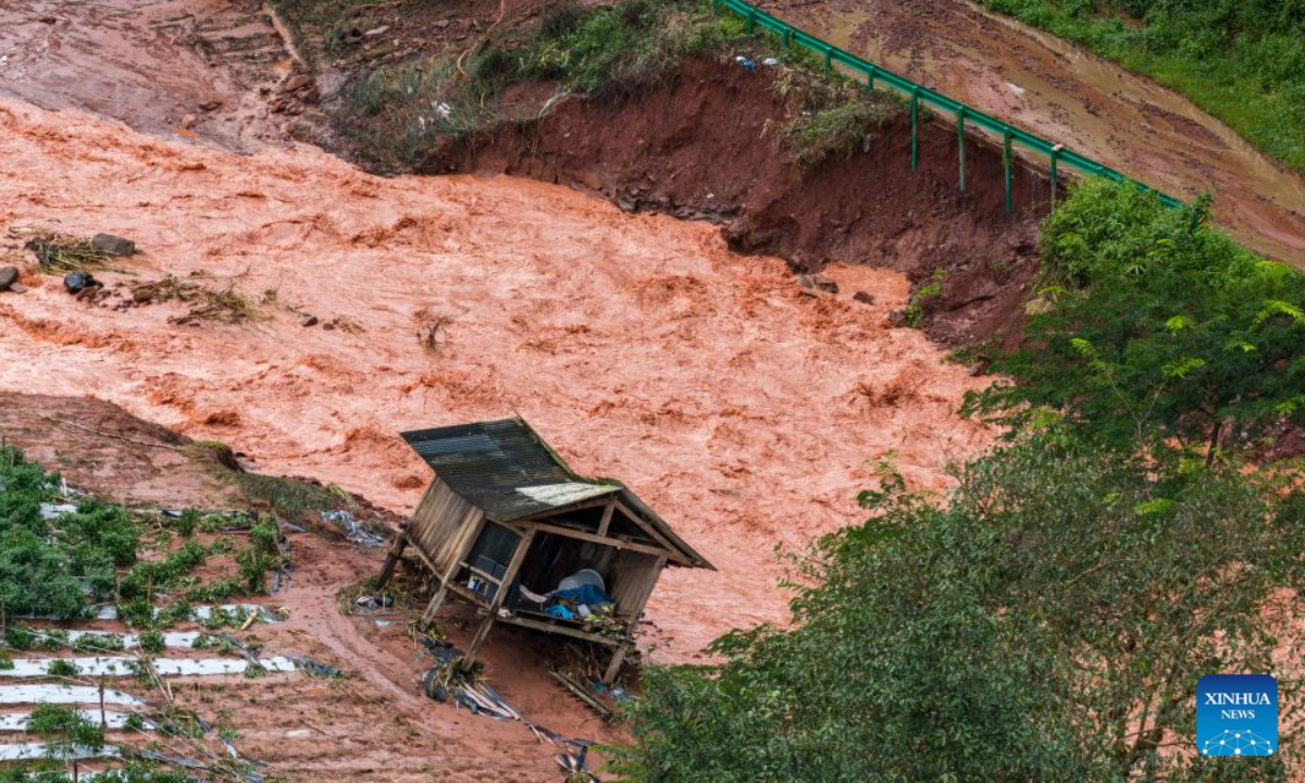 A drone photo shows a house and farm fields damaged by flood in Molong Village of Mohan Town, southwest China's Yunnan Province, Aug. 30, 2026.
Heavy rainfall has triggered severe flooding in Mohan Town in southwest China's Yunnan Province, with a reservoir at risk of breaching, authorities said Saturday.
Altogether 8,115 residents have been evacuated in emergency by Sunday, and relief items are dispatched to relocations sites to meet people's necessities. (Xinhua/Hu Chao)