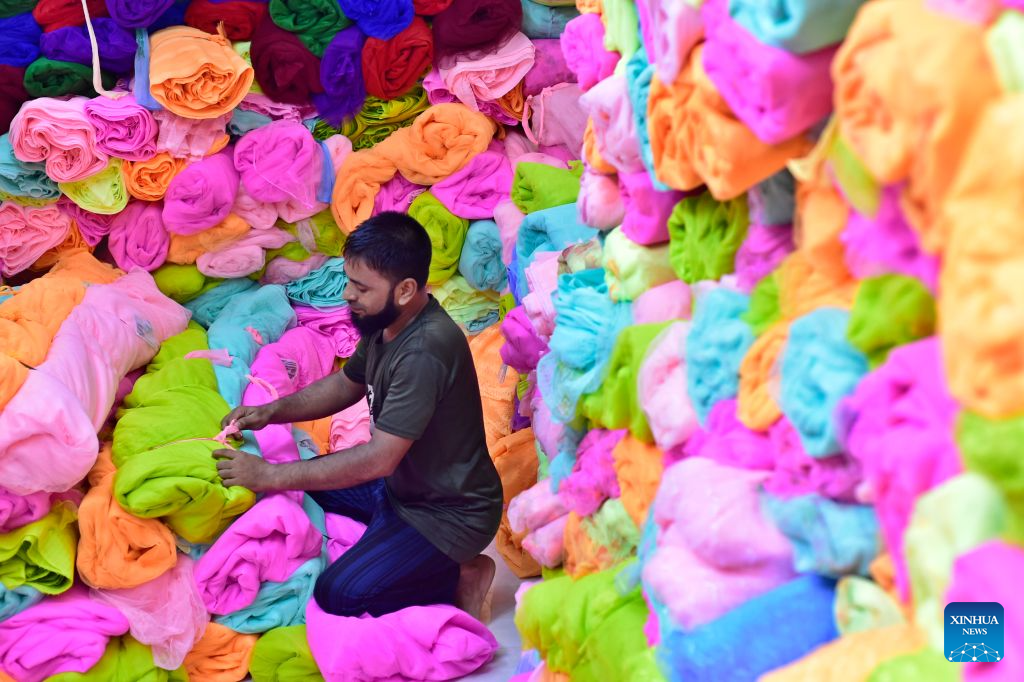 A seller works at a wholesale market for mosquito nets in Narayanganj, Bangladesh, on Sept. 14, 2026. Bangladesh has seen a rising demand for mosquito nets and other protective products amid an ongoing dengue outbreak. (Photo by Habibur Rahman/Xinhua)