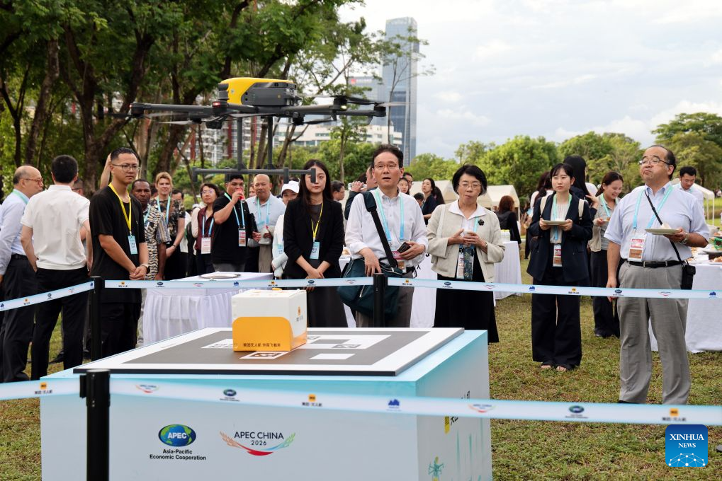 Attendees of the 2026 APEC Ministerial Meeting on Forestry watch a drone delivering meal package at an ecological preservation stripe in Shenzhen, south China's Guangdong Province, July 28, 2026. The meeting was held in Shenzhen from July 27 to 28. (Xinhua/Liang Xu)