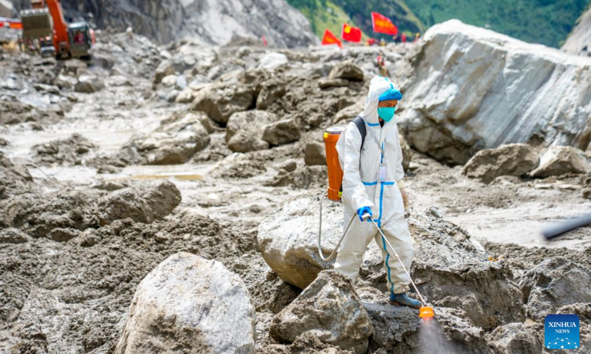 A health worker carries out disinfection work at the core affected zone of the mudslide-hit Gyirong Port in southwest China's Xizang Autonomous Region, Sept. 3, 2026. Teams of health workers from multiple units carried out comprehensive disinfection work at the core affected zone of the mudslide-hit Gyirong Port on Thursday. To date, a total of 35,500 square meters have been disinfected. (Xinhua/Tenzin Nyida)