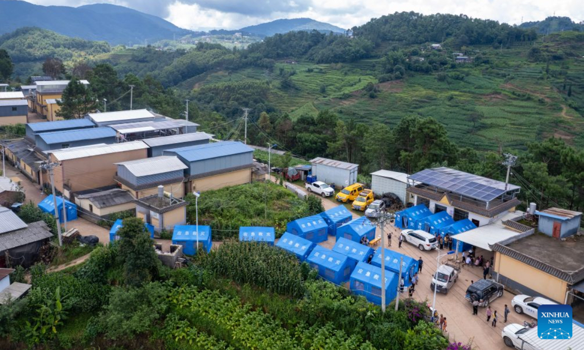A drone photo shows a view of a temporary shelter at Jingping Village in Yutang Town of Mojiang Hani Autonomous County, southwest China's Yunnan Province, on July 22, 2026. The Yunnan provincial earthquake relief headquarters has activated a Level-IV emergency response after a 5.0-magnitude earthquake jolted Mojiang on Tuesday, local authorities said. No casualties have been reported so far. (Xinhua/Chen Xinbo)