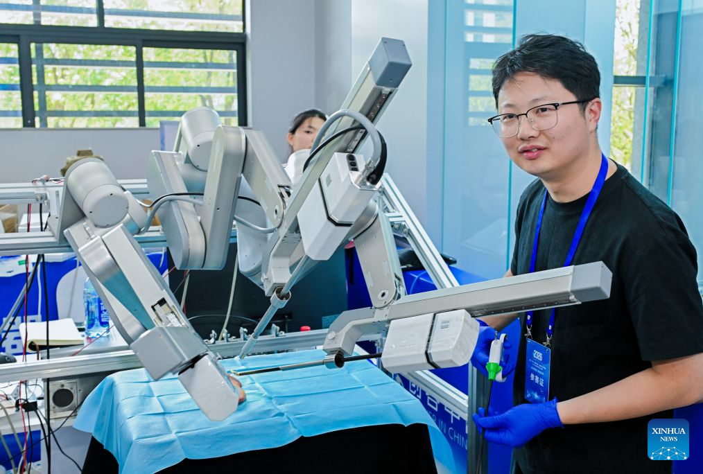 This photo taken on Sept. 9, 2026 shows robot surgical operation competition during the final of the 11th Maker in China intelligent bionic robot innovation and entrepreneurship competition for small and medium-sized enterprises in Chongqing, southwest China. The final of the event kicked off in Chongqing on Wednesday, with the participation of some 100 teams from all over the country. This competition will last until Sept. 11. (Xinhua)
