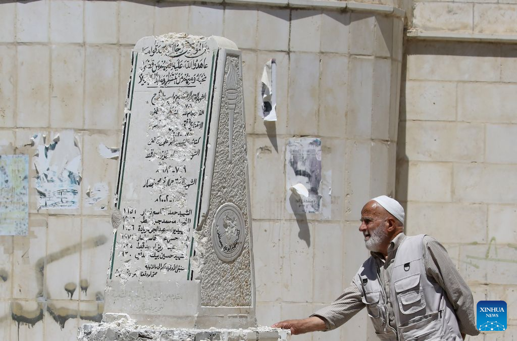 A Palestinian inspects a Palestinian martyrs' memorial damaged by an Israeli settlers' attack, in Madma village in the West Bank city of Nablus, on Aug. 25, 2026. (Photo by Nidal Eshtayeh/Xinhua)