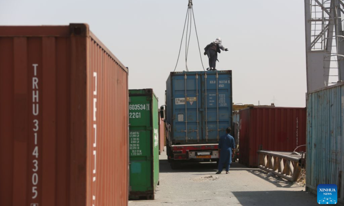 Workers operate at loading area of Hairatan railway port in Balkh Province, northern Afghanistan, Sept. 17, 2026. (Photo by Saifurahman Safi/Xinhua)