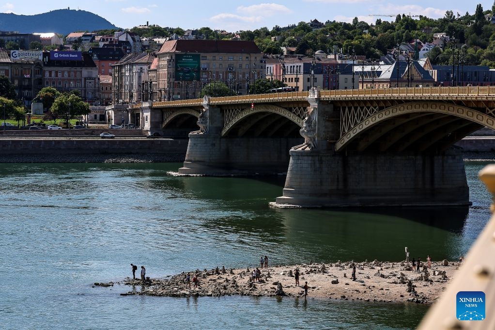 Photo taken on July 28, 2026 shows the Danube River with its partially exposed riverbed in Budapest, Hungary. The water level of the Danube River in Budapest fell to a record low of 31 centimeters on Tuesday, according to Hungary's General Directorate of Water Management. The reading surpassed the previous record low of 33 centimeters which was measured on October 25, 2018, as prolonged drought and a lack of rainfall continue to affect much of the region. (Photo by David Balogh/Xinhua)