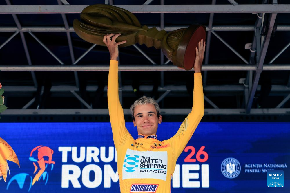 Barnabas Vas of Hungary celebrates winning the Tour of Romania cycling race in Bucharest, Romania, Sept. 13, 2026. (Photo by Cristian Cristel/Xinhua)