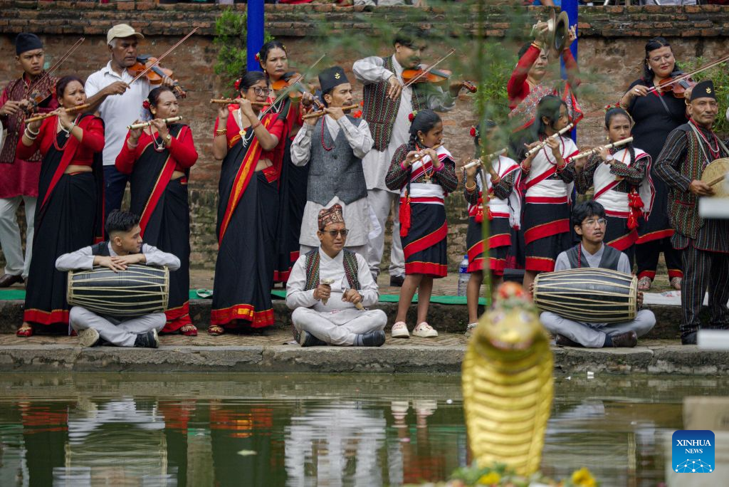 People in traditional attire perform during a celebration of Nag Panchami, a Hindu festival dedicated to the worship of snakes, in Bhaktapur, Nepal, Aug. 17, 2026. (Photo by Sulav Shrestha/Xinhua)
