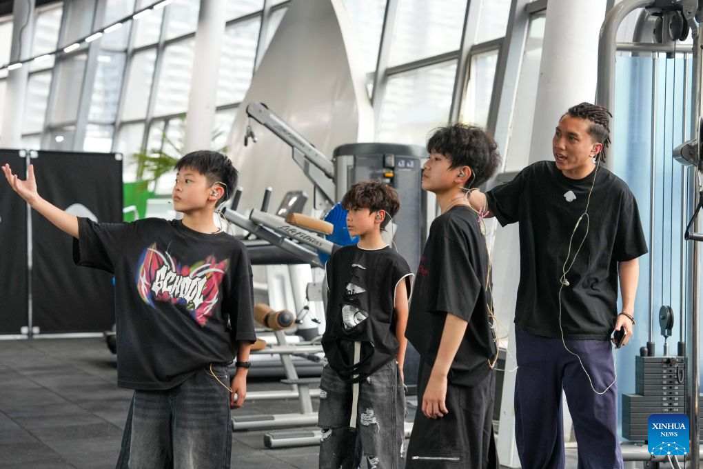 Fang Zhenghua (R) instructs Homies dancers at Dancehome studio in Chengdu, southwest China's Sichuan Province, June 13, 2026.
Fang Zhenghua, a post-90s choreographer, has participated in the production of a series of eye-catching dancing performances, including a show featuring dancers and humanoid robots at the opening ceremony of the 48th WorldSkills Competition. For Fang, street dance has never been merely a passing trend.
Fang's love for street dance began at the age of 13, when he first learned popular dance moves from television. That early fascination soon grew into a lifelong pursuit, driving him to explore new possibilities on stage. A big fan of Chinese martial arts novels since childhood, Fang has integrated Sichuan Opera face-changing techniques, traditional Kung Fu movements and other distinct Chinese cultural elements into his choreography.
In March 2025, Fang and Homies, a street dance team of his studio Dancehome, won third place at the VIBE Dance Competition with their work Sword and Qi in Sichuan. This was the first time a Chinese team had claimed an award in the competition's 30-year history. His team has also collaborated with domestic humanoid robot developers, staging performances that showcase China's technological advances.
Nearly 20 years of dedication has brought Fang to stages around the world. When we compete abroad, our goal is not just to show the world how Chinese dancers move, he said. We want them to see a rich, diverse China through every step we take. (Xinhua/Xu Bingjie)