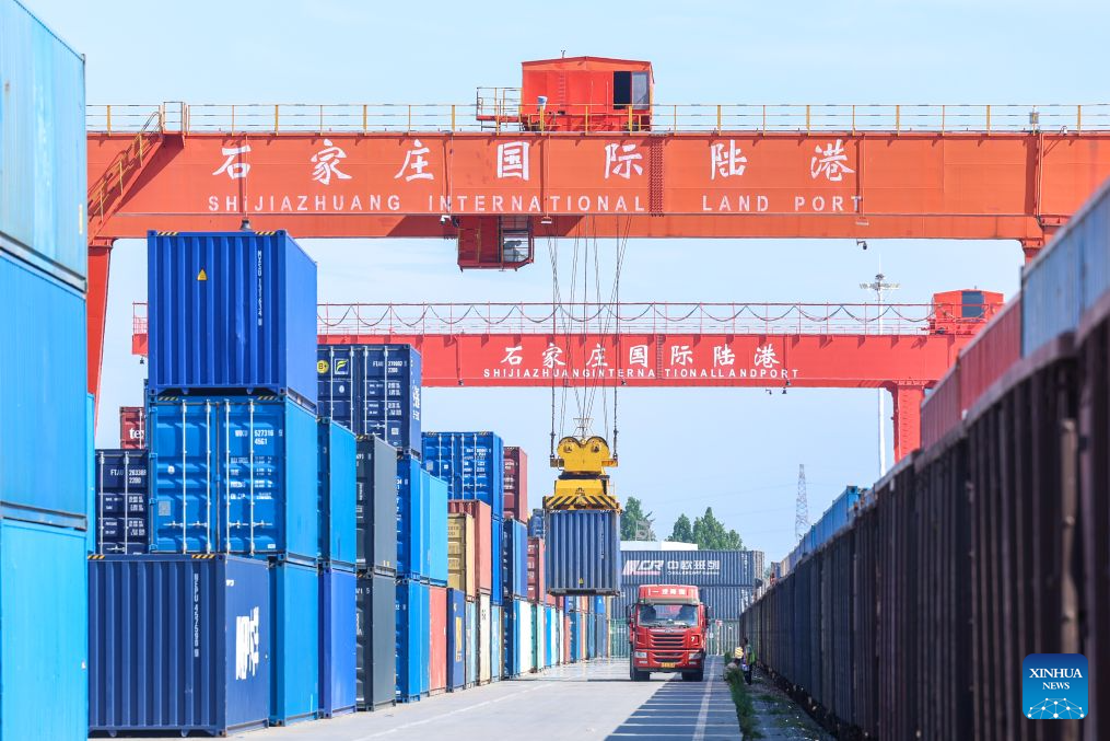 This photo taken on Aug. 4, 2026 shows a container loading site of the Shijiazhuang international land port in north China's Hebei Province. Shijiazhuang international land port in north China's Hebei Province handled a total of 814 China-Europe and China-Central Asia freight train trips in the first half of 2026, up 42.06 percent year on year. (Photo by Liang Zidong/Xinhua)