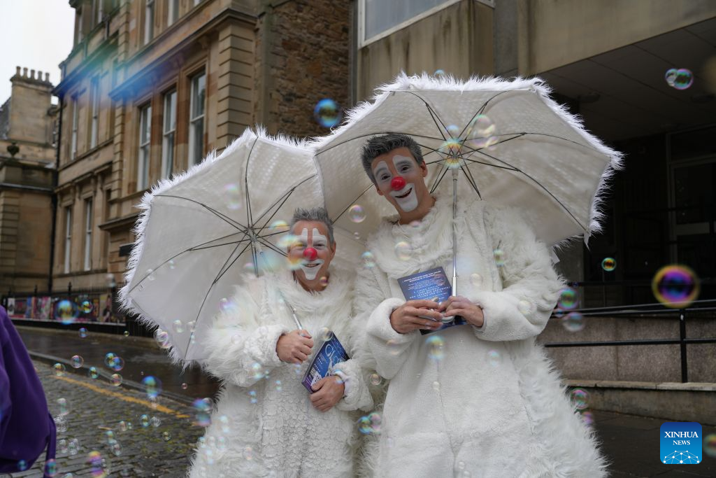This photo taken on Aug. 9, 2026 shows actors from a show for the Edinburgh Festival Fringe in Edinburgh, Britain. A series of cultural events, including the Edinburgh International Festival, the Edinburgh Festival Fringe, and the Royal Edinburgh Military Tattoo, kicked off in Edinburgh on Aug. 7, attracting artists and audiences from around the world. (Xinhua/Zhao Jiasong)