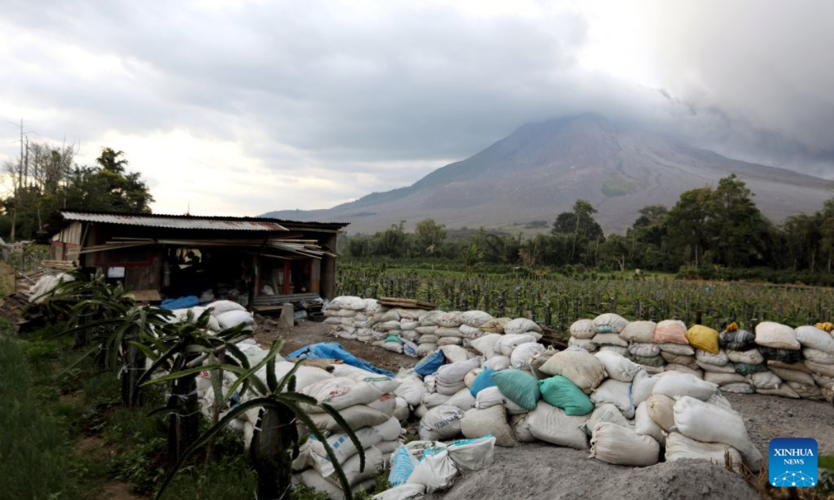Volcanic materials are seen spewing from Mount Sinabung in North Sumatra Province, Indonesia, Aug. 31, 2026. Mount Sinabung in Indonesia's North Sumatra province erupted Monday morning, sending volcanic ash over the nearby city of Berastagi, a local monitoring official said. (Photo by Adiva Niki/Xinhua)