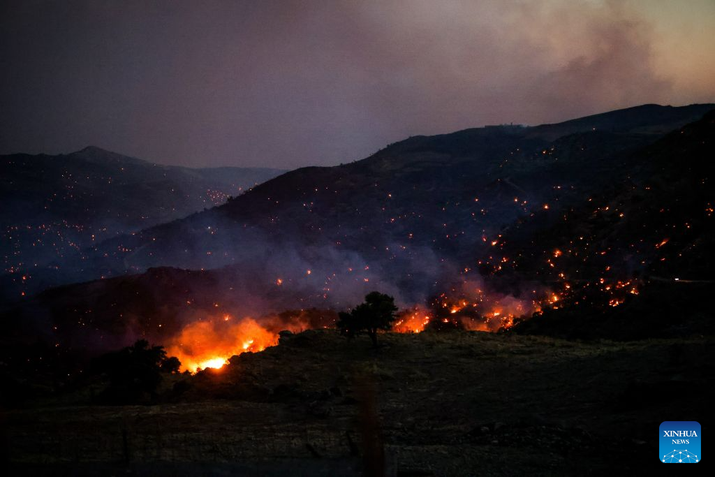 Smoke rises from a wildfire in Rethymno on the island of Crete, Greece, July 29, 2026. Two firefighters lost their lives while battling a fast-moving wildfire in Rethymno on the Greek island of Crete on Wednesday, as gale-force winds fueled the blaze across a front stretching more than 15 kilometers. (Photo by Rapanis Spiros/Xinhua)