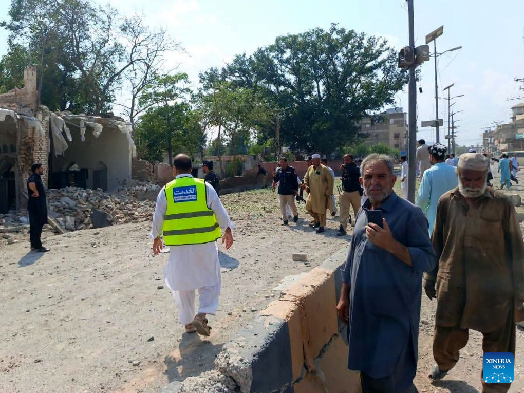 This photo taken with mobile phone shows a blast site at Kohat in Pakistan's Khyber Pakhtunkhwa province on Sept. 18, 2026. At least 16 people were killed and over 50 others injured in a twin suicide attack inside a residential compound of police in Pakistan's Khyber Pakhtunkhwa province on Friday, police and rescue officials said. (Str/Xinhua)