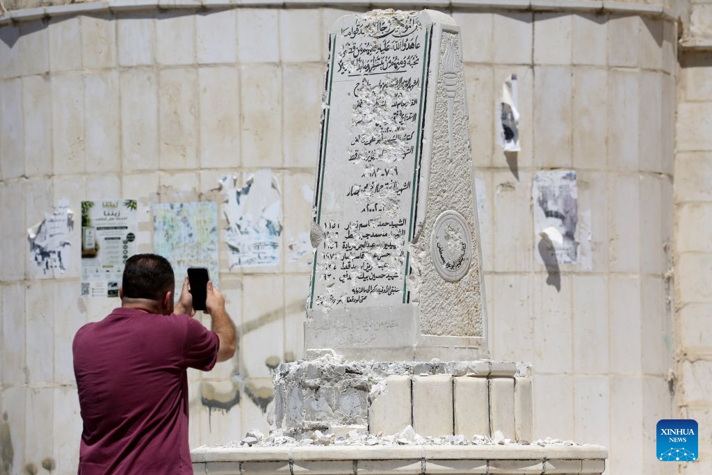 A Palestinian inspects a Palestinian martyrs' memorial damaged by an Israeli settlers' attack, in Madma village in the West Bank city of Nablus, on Aug. 25, 2026. (Photo by Nidal Eshtayeh/Xinhua)