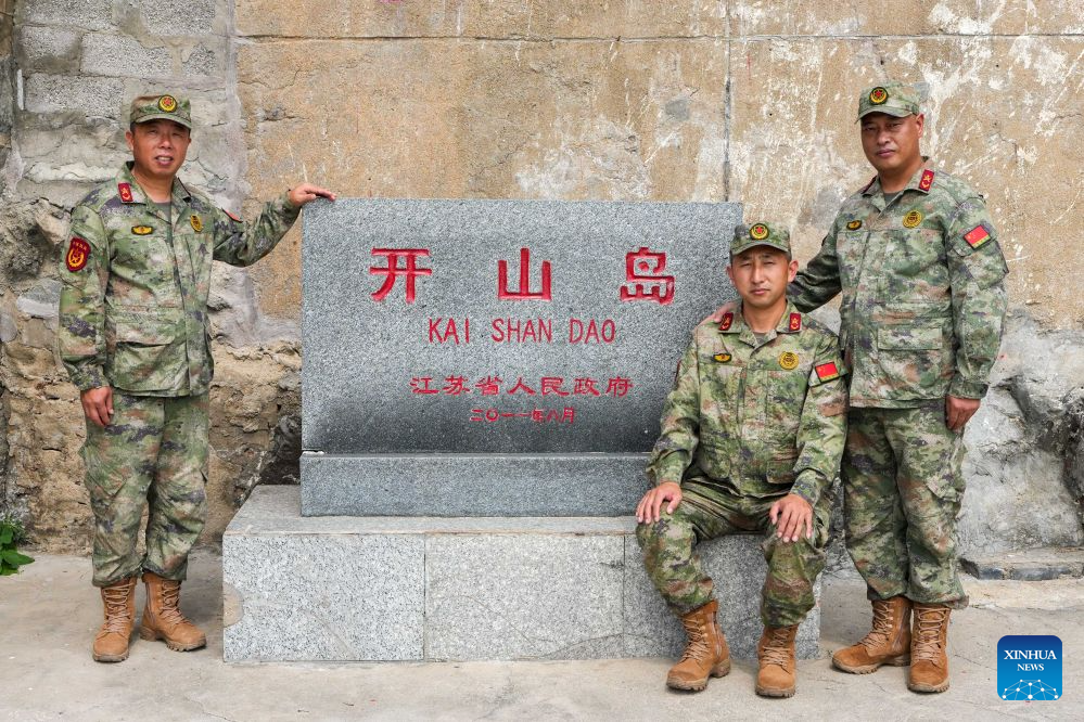 Militia members Sun Cundong (L), Han Tongyong (C), and Liang Denggao are pictured during a patrol on Kaishan Island in east China's Jiangsu Province, Sept. 13, 2026. Kaishan Island, located 12 nautical miles off the coast of Guanyun County in east China's Jiangsu Province, is a small but strategically important island in the Yellow Sea. With harsh natural conditions and frequent typhoons, the island is home to a rotating team of militia members who take turns guarding it. Their daily duties include monitoring the surrounding waters, patrolling the island, maintaining navigation aids and recording observations, with any unusual activity reported promptly.

Living conditions on the island have improved in recent years. A smart microgrid combining wind, solar and energy storage, along with a seawater desalination system, began operating in 2019, ending the island's reliance on weather-dependent power and rainwater. In 2021, an all-electric kitchen and other facilities were put into operation, further improving conditions for those stationed there.

Successive generations of militia members have taken turns guarding Kaishan Island, carrying on the duty of safeguarding the remote outpost. (Xinhua/Li Bo)