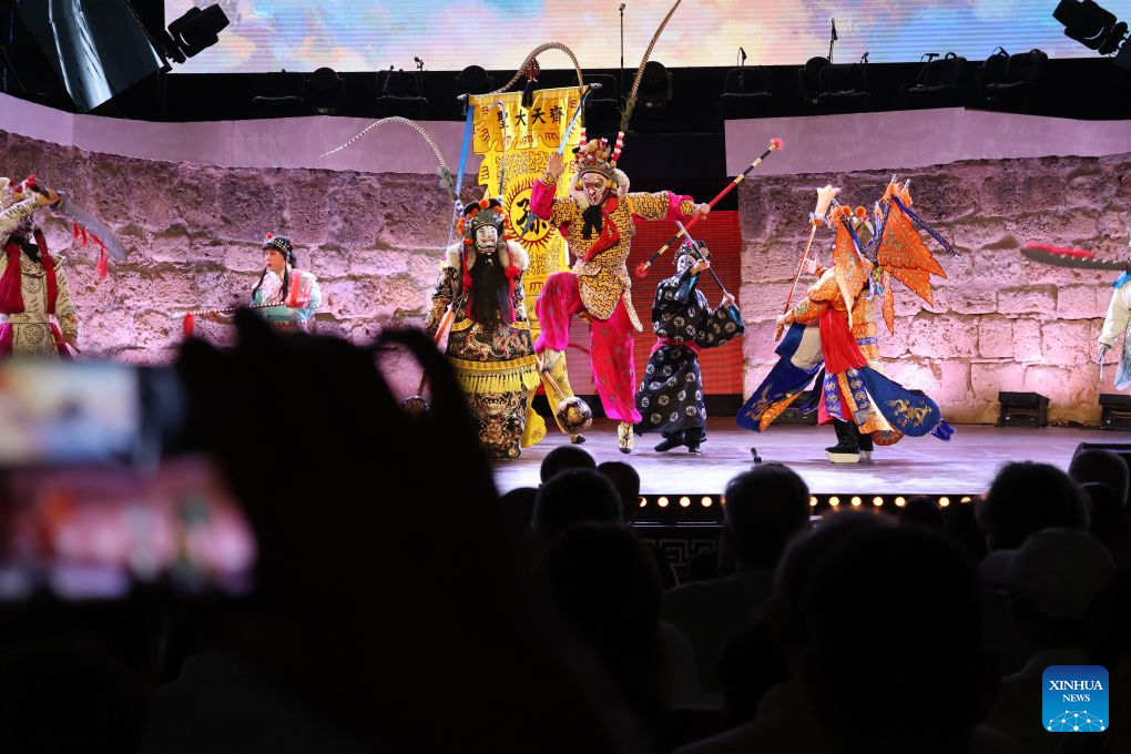 Artists of the China National Peking Opera Company perform at the ancient theatre of Carthage in Tunis, Tunisia, Aug. 11, 2026. The China National Peking Opera Company presented a performance on Tuesday at the Folklores of the World event during the 60th Carthage Festival in Tunis. (Xinhua/Zhou Haojin)