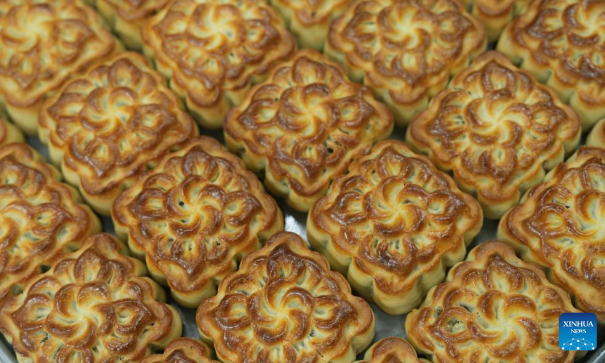 This photo taken on Sept. 17, 2026 shows freshly baked mooncakes at a traditional confectionery shop in Hanoi, Vietnam. A festive atmosphere is growing here as the Mid-Autumn Festival approaches. (Xinhua/Hu Jiali)
