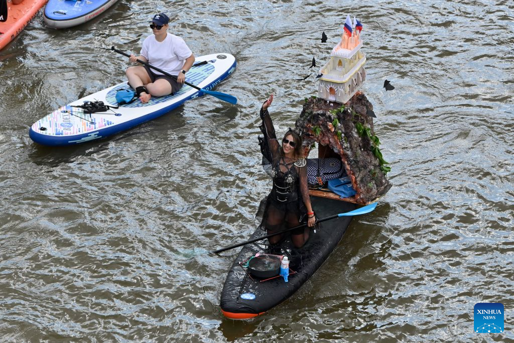 People take part in the annual Yauzafest paddleboarding festival in Moscow, Russia, on Aug. 9, 2026. (Photo by Alexander Zemlianichenko Jr/Xinhua)