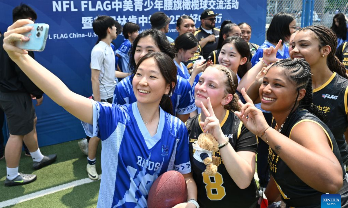 Students of Lincoln High School of the U.S. state of Washington and Beijing National Day School take selfies during the NFL FLAG China-U.S. Youth Flag Football Exchange Event & Lincoln High School 2025 China Tour in Beijing, capital of China, May 26, 2025. The hope of the China-U.S. relationship lies in the people, its foundation is in the societies, its future depends on the youth, and its vitality comes from exchanges at subnational levels.
In recent years, the two countries have been strengthening people-to-people ties through cultural exchanges to inject sustained positive momentum into China-U.S relations. (Xinhua/Li He)
