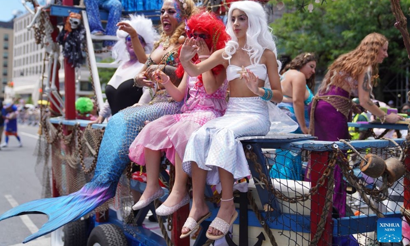 People participate in the 2026 Mermaid Parade on the Coney Island in New York, the United States, June 20, 2026. (Xinhua/Zhang Fengguo)