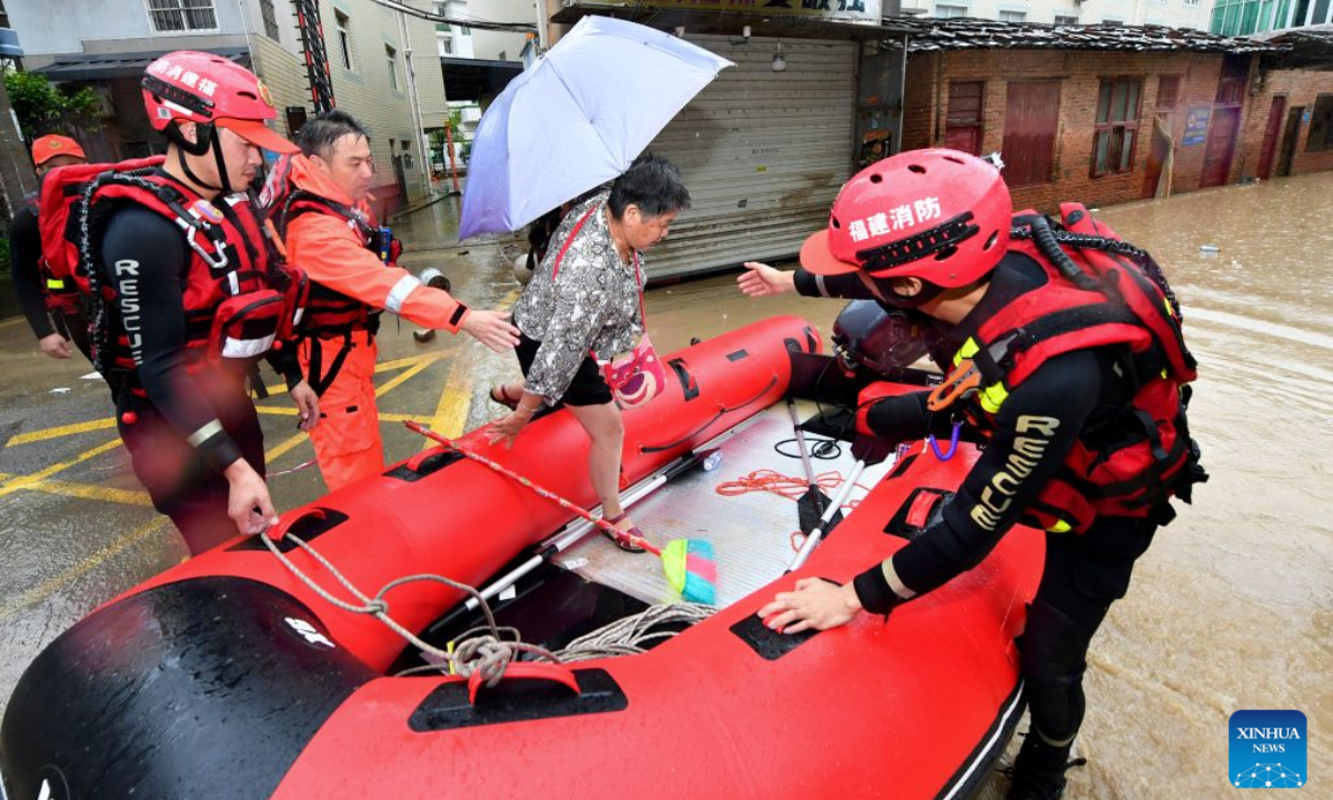 Rescuers evacuate a resident in Nanqian Village of Minhou County, southeast China's Fujian Province, Sept. 3, 2026. Typhoon Saudel brought torrential rains to Minhou County of Fujian Province, resulting in waterlogging in some areas. Emergency flood-control, drainage and resident-evacuation operations were conducted to safeguard public safety. (Xinhua/Jiang Kehong)