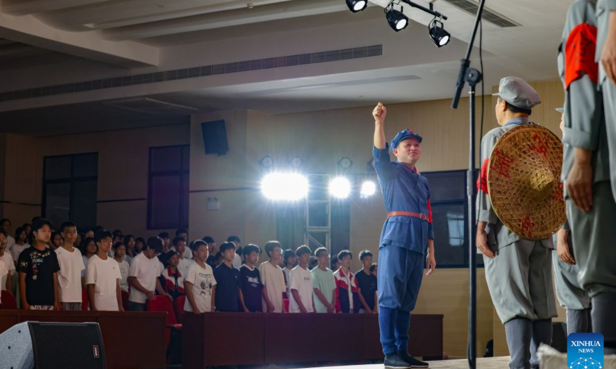 The Long March Origin choir perform at a middle school in Yudu County, east China's Jiangxi Province, Sept. 3, 2026. (Xinhua/Wang Jingqiang)