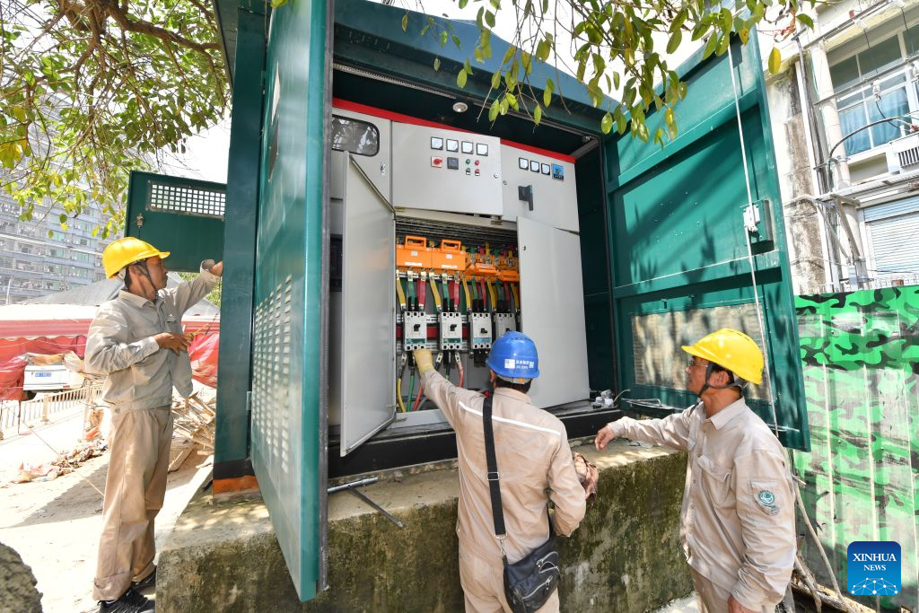 Electricians repair a power facility in Huating Town of Putian, southeast China's Fujian Province, Sept. 7, 2026. As heavy rainfall caused by Typhoon Saudel in Putian concluded on Saturday, floodwaters gradually receded in inundated areas of this city. Local authorities have since shifted to post-disaster recovery, undertaking tasks including water and power restoration, sanitation and disinfection, as well as the resettlement of affected residents. (Xinhua/Jiang Kehong)
